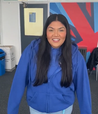 Student in a blue Care fleece giving feedback (video thumbnail) links to video
